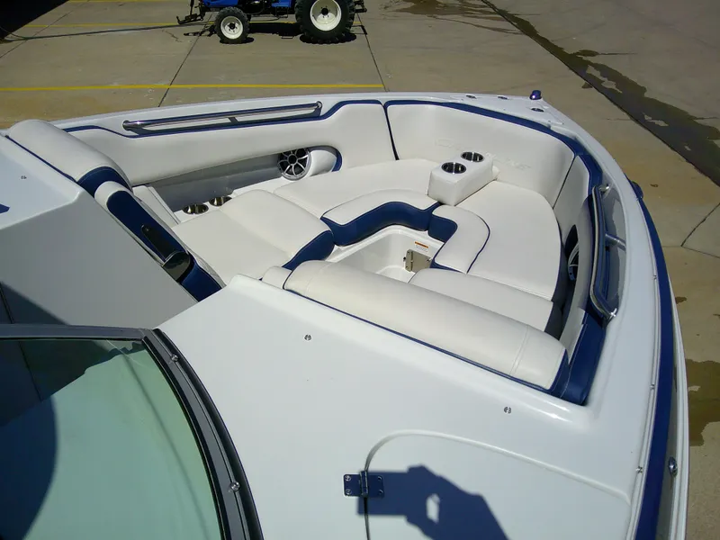 Slide: The Image of 2021 Crownline 255 SS boat interior with white and blue seating. - 9