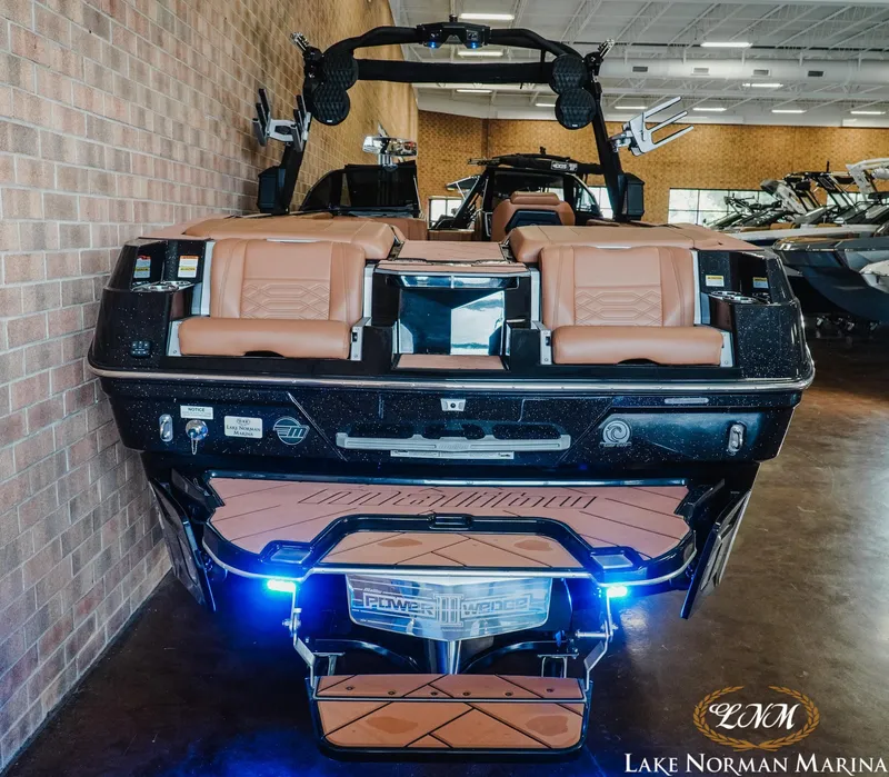 Slide: The Image of 2023 Malibu 26 LSV boat with tan seats at Lake Norman Marina. - 10