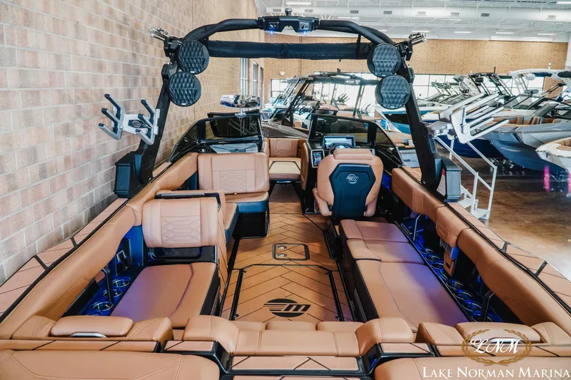 Slide: The Image of 2023 Malibu 26 LSV boat interior with luxurious seating at Lake Norman Marina. - 11