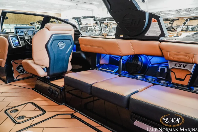 Slide: The Image of Luxurious interior of 2023 Malibu 26 LSV boat with leather seating and modern dashboard. - 17