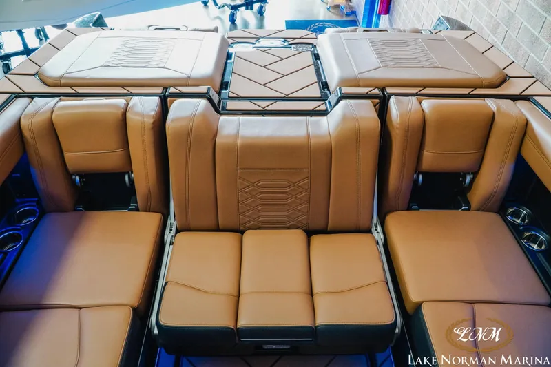 Slide: The Image of Luxurious tan seating on 2023 Malibu 26 LSV boat at Lake Norman Marina. - 28
