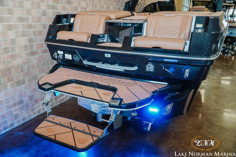 Slide: The Image of 2023 Malibu 26 LSV boat with illuminated swim platform at Lake Norman Marina. - 9