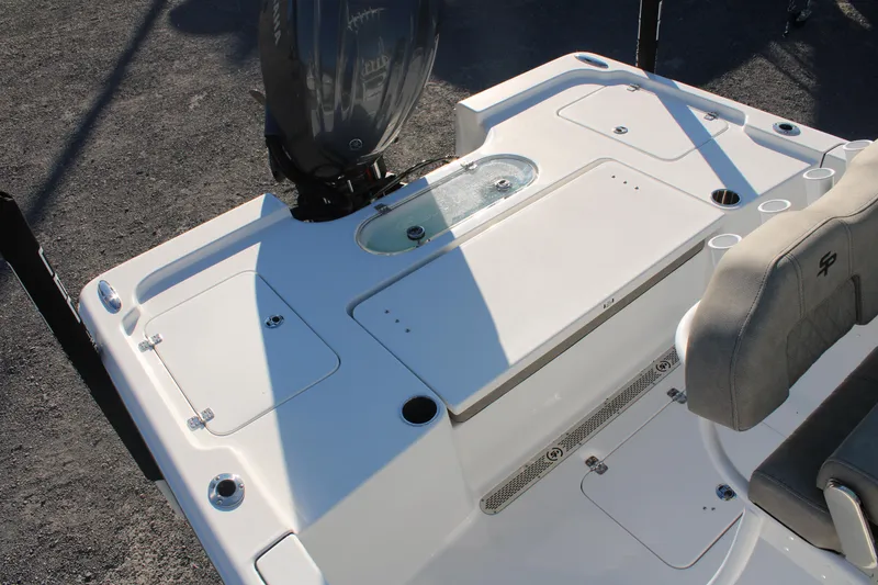 Slide: The Image of 2024 Sea Pro 250 Bay boat deck with seating and storage compartments. - 13