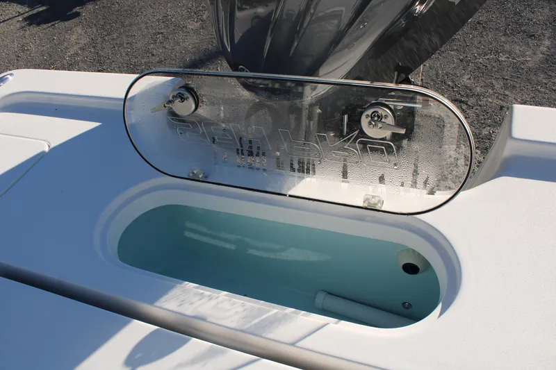 Slide: The Image of 2024 Sea Pro 250 Bay boat livewell with transparent lid and sleek design. - 17