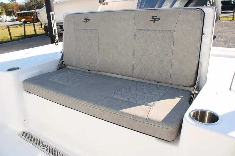 Slide: The Image of 2024 Sea Pro 250 Bay boat with gray cushioned seating and cup holder. - 20