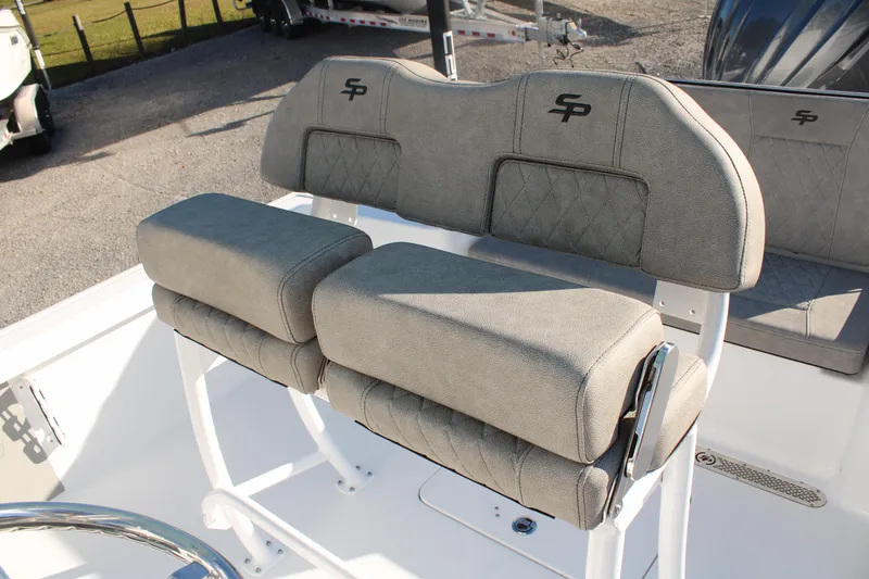 Slide: The Image of 2024 Sea Pro 250 Bay boat seating with gray cushioned seats and backrests. - 21