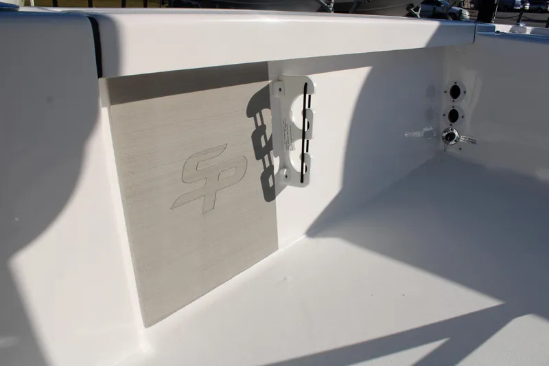 Slide: The Image of 2024 Sea Pro 250 Bay boat interior detail with logo and mounting bracket. - 30