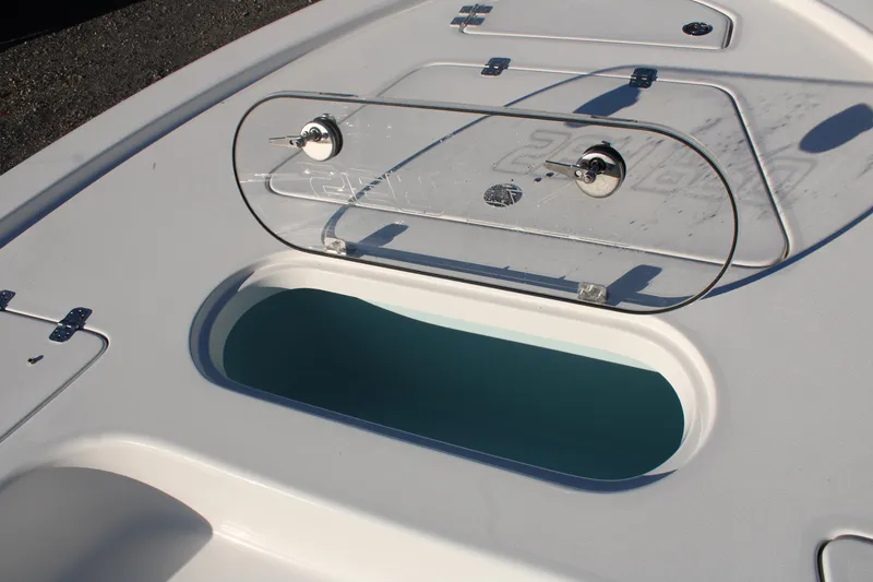 Slide: The Image of 2024 Sea Pro 250 Bay boat with open storage compartment on deck. - 35