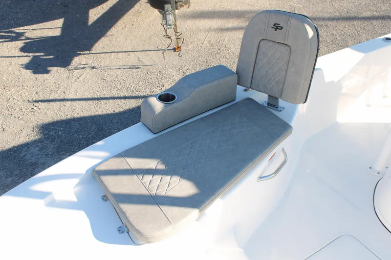 Slide: The Image of 2024 Sea Pro 250 Bay boat seating with cup holder, featuring gray upholstery. - 38
