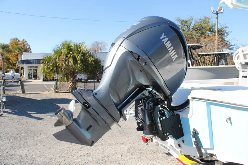 Slide: The Image of 2024 Sea Pro 250 Bay boat with Yamaha outboard motor, parked outdoors. - 8