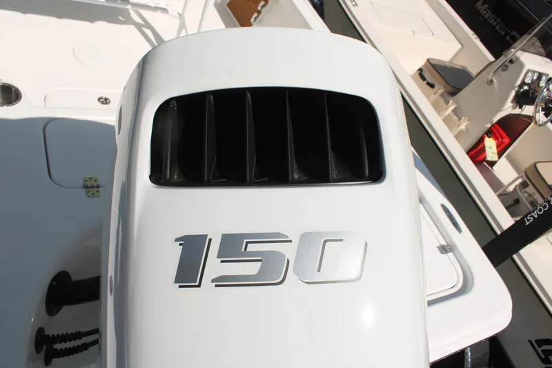 Slide: The Image of 2024 Sea Pro 210 boat engine with "150" horsepower marking, showcasing sleek design. - 12