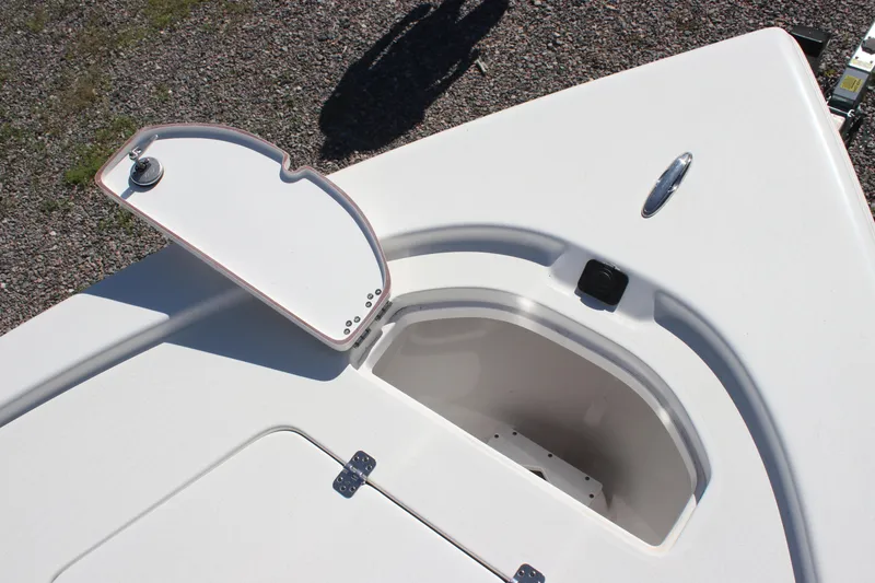 Slide: The Image of 2024 Sea Pro 210 boat storage compartment with open hatch, showcasing sleek design and functionality. - 3