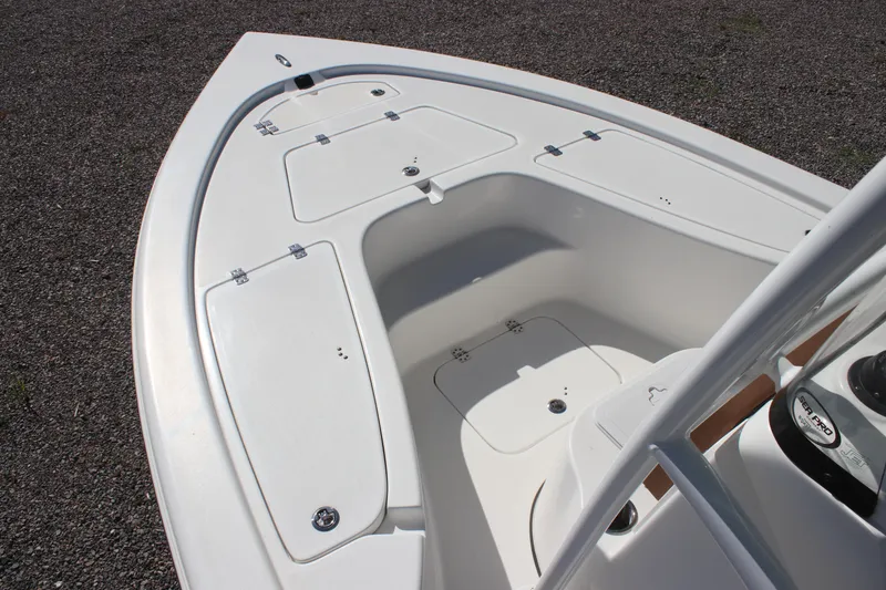 Slide: The Image of 2024 Sea Pro 210 boat deck with storage compartments and sleek design. - 4
