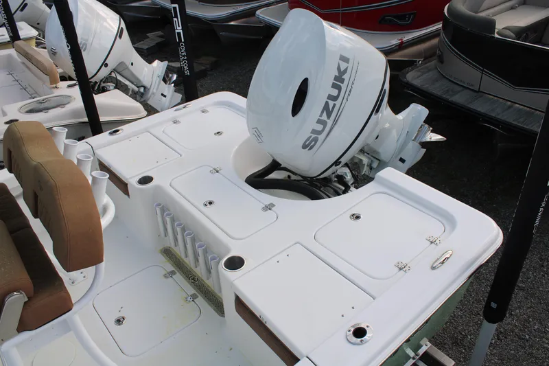 Slide: The Image of 2024 Sea Pro 210 boat with Suzuki outboard motor, featuring a spacious deck layout. - 9