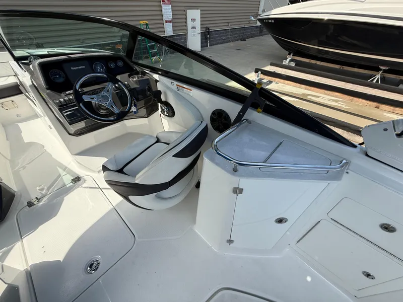Slide: The Image of 2018 Monterey M-45 boat interior with steering wheel and seating area. - 10