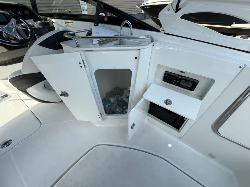 Slide: The Image of Interior of a 2018 Monterey M-45 boat with open storage compartments and sink. - 11