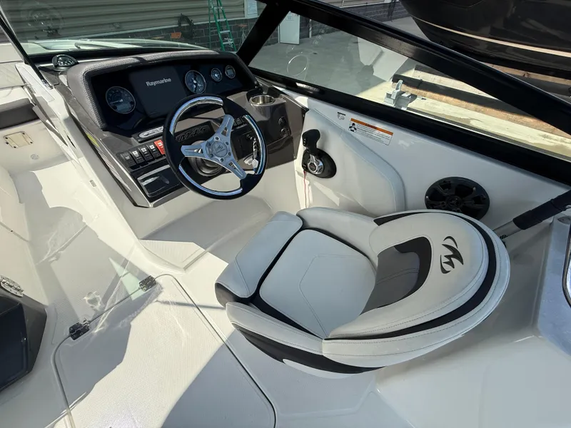 Slide: The Image of 2018 Monterey M-45 boat interior with steering wheel and dashboard controls. - 12