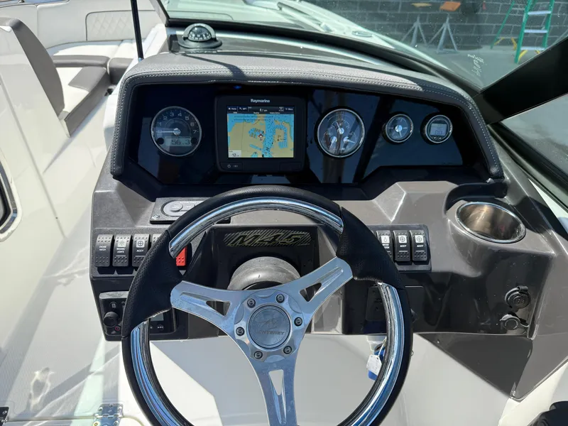 Slide: The Image of Steering console of 2018 Monterey M-45 boat with navigation display and controls. - 13