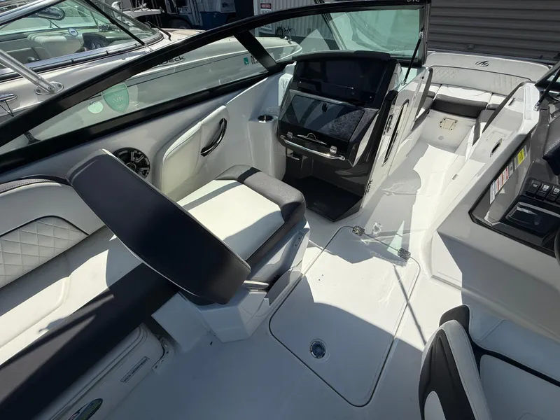 Slide: The Image of Interior of a 2018 Monterey M-45 boat, featuring sleek seating and modern controls. - 16