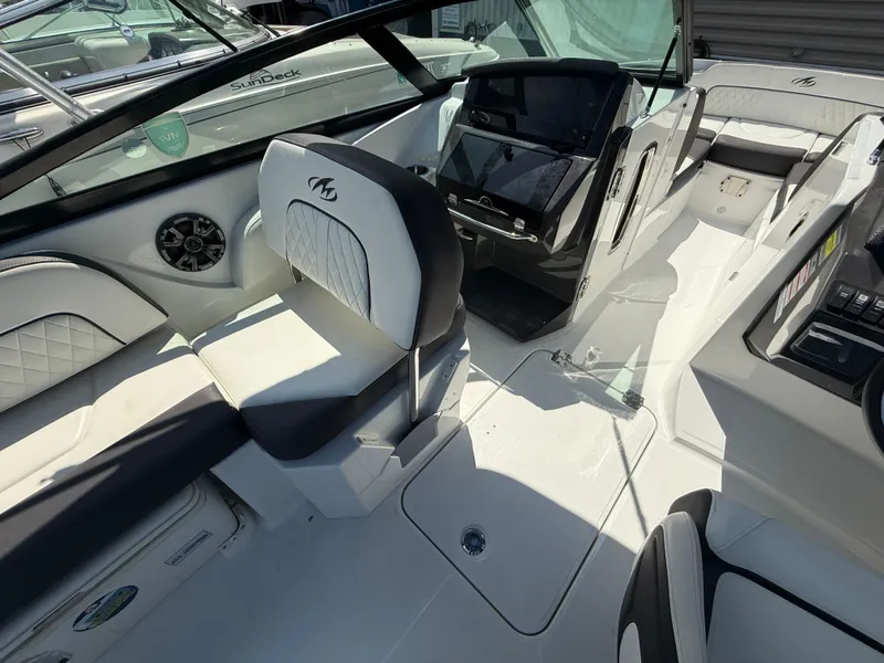 Slide: The Image of Interior of a 2018 Monterey M-45 boat with sleek seating and modern dashboard. - 17