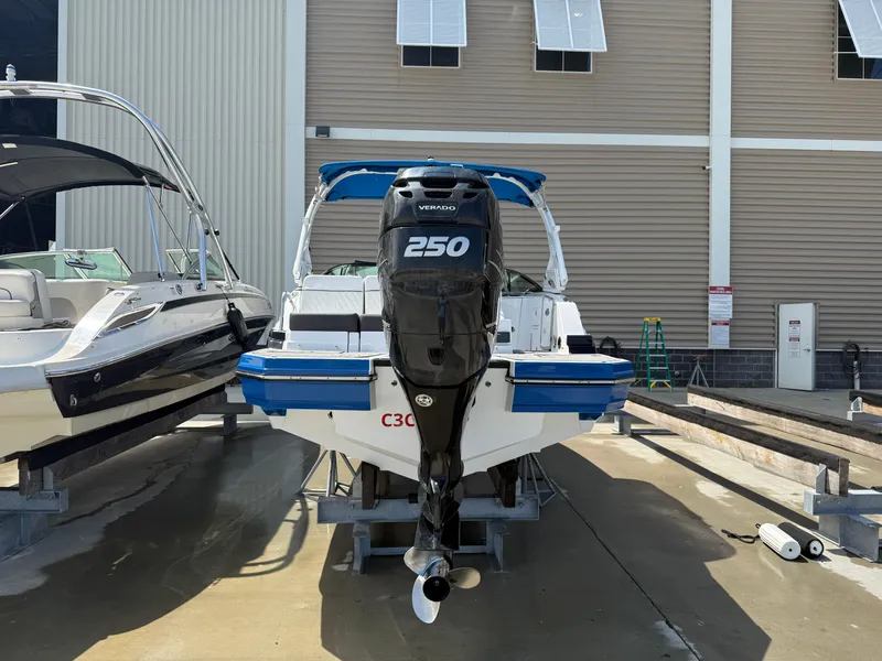 Slide: The Image of 2018 Monterey M-45 boat with a 250 horsepower engine, docked in a marina. - 2