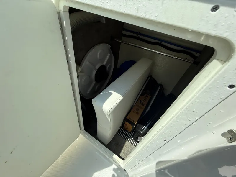 Slide: The Image of Storage compartment in a 2018 Monterey M-45 boat, featuring seating and equipment. - 21