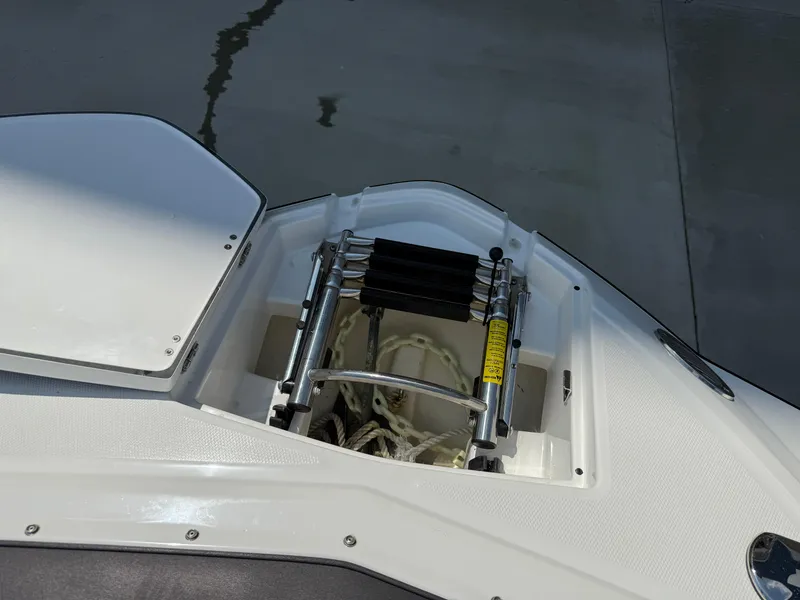 Slide: The Image of Bow of 2018 Monterey M-45 boat with retractable ladder and storage compartment. - 24