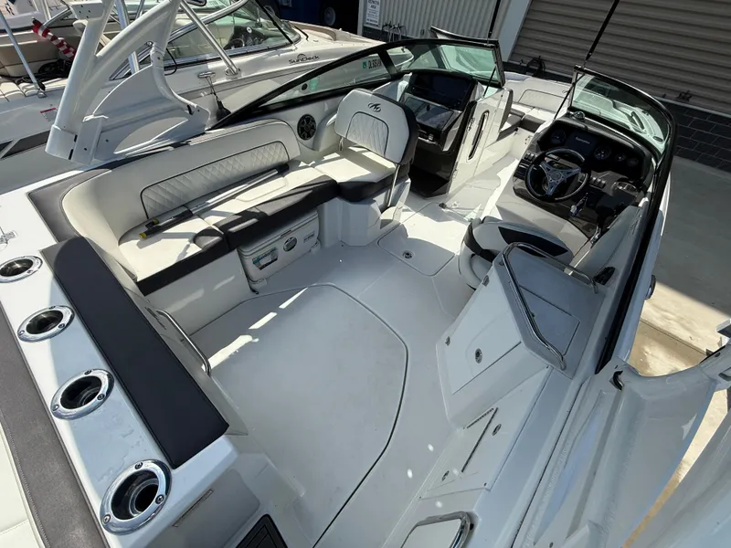 Slide: The Image of 2018 Monterey M-45 boat interior with seating, steering wheel, and cup holders. - 6