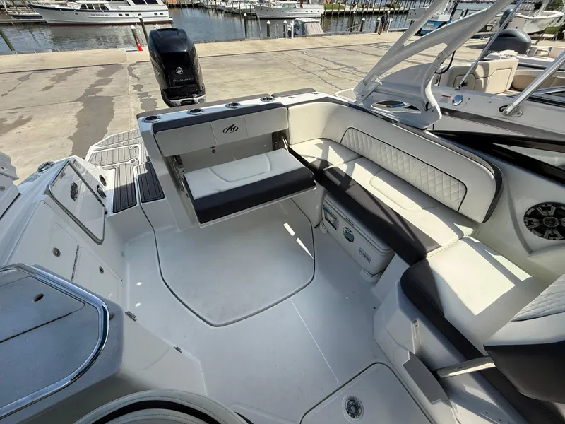 Slide: The Image of 2018 Monterey M-45 boat interior with seating, docked at marina. - 8