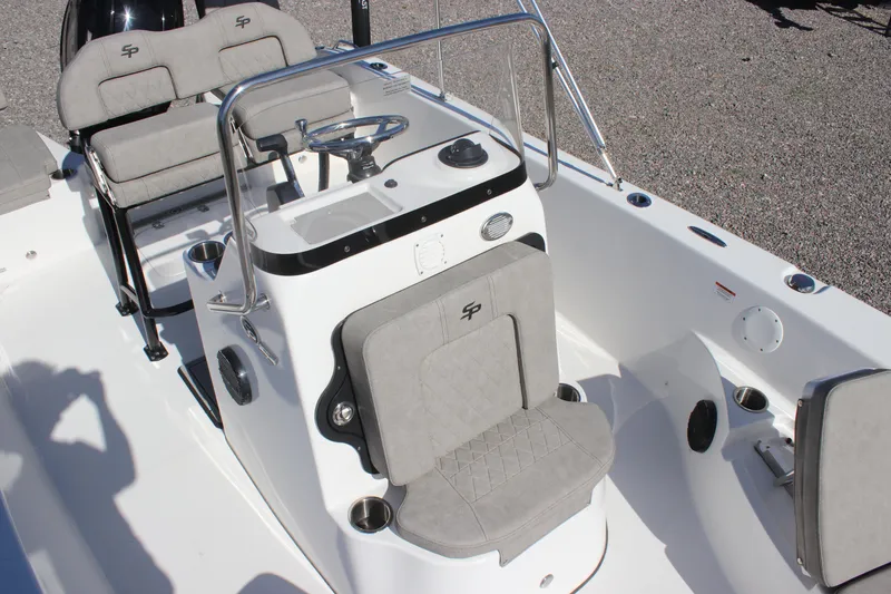 Slide: The Image of 2024 Sea Pro 202 CC boat interior with steering console and seating. - 10