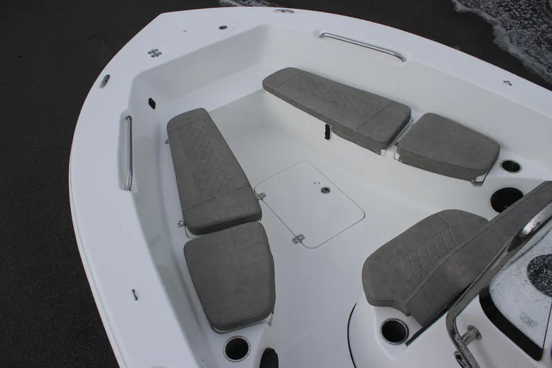Slide: The Image of 2024 Sea Pro 202 CC boat interior with gray cushioned seating and storage compartments. - 18