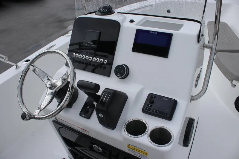 Slide: The Image of 2024 Sea Pro 202 CC boat console with steering wheel and modern controls. - 21