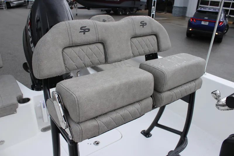 Slide: The Image of 2024 Sea Pro 202 CC boat seating with gray upholstery and SP logo. - 22