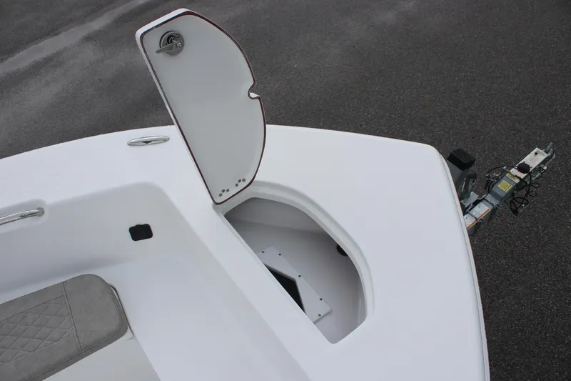 Slide: The Image of 2024 Sea Pro 202 CC boat with open storage compartment on deck. - 27