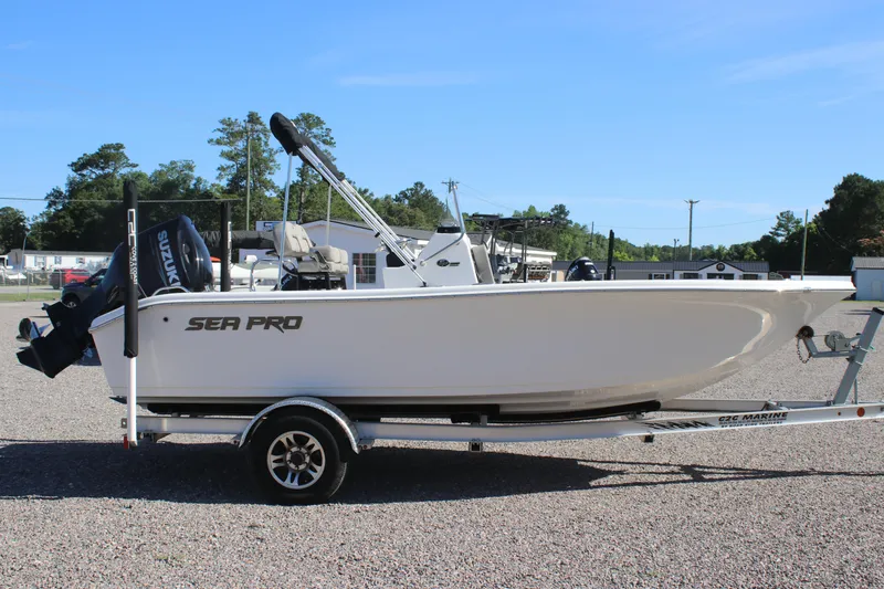 Slide: The Image of 2024 Sea Pro 202 CC boat on trailer, side view, outdoors. - 3