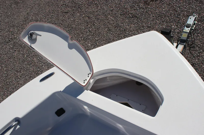 Slide: The Image of 2024 Sea Pro 202 CC boat storage compartment with open hatch on deck. - 6