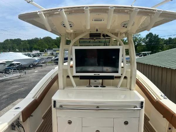Slide: The Image of 2018 Scout 350 LXF boat with helm station and electronics display. - 9