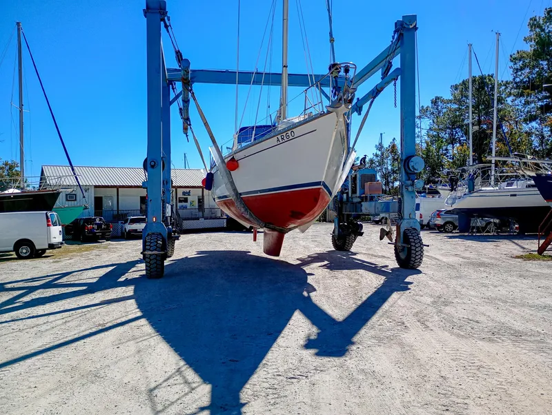 Slide: The Image of 1989 Morgan 44 Center Cockpit sailboat in dry dock, supported by a boat lift. - 27