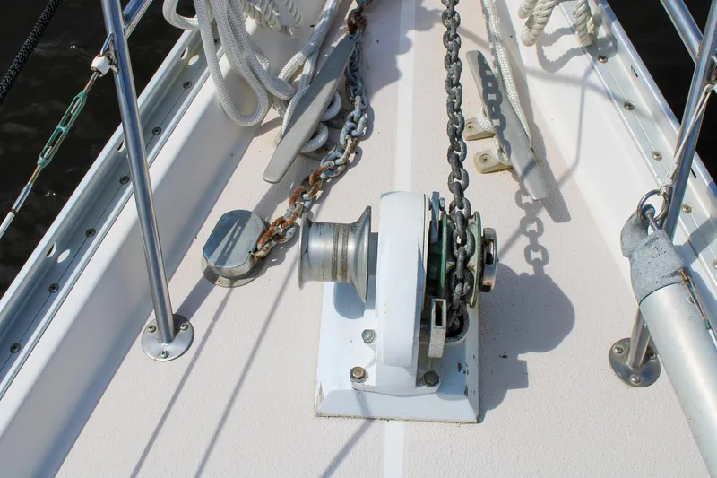 Slide: The Image of Anchor windlass on 1989 Morgan 44 Center Cockpit sailboat deck. - 34