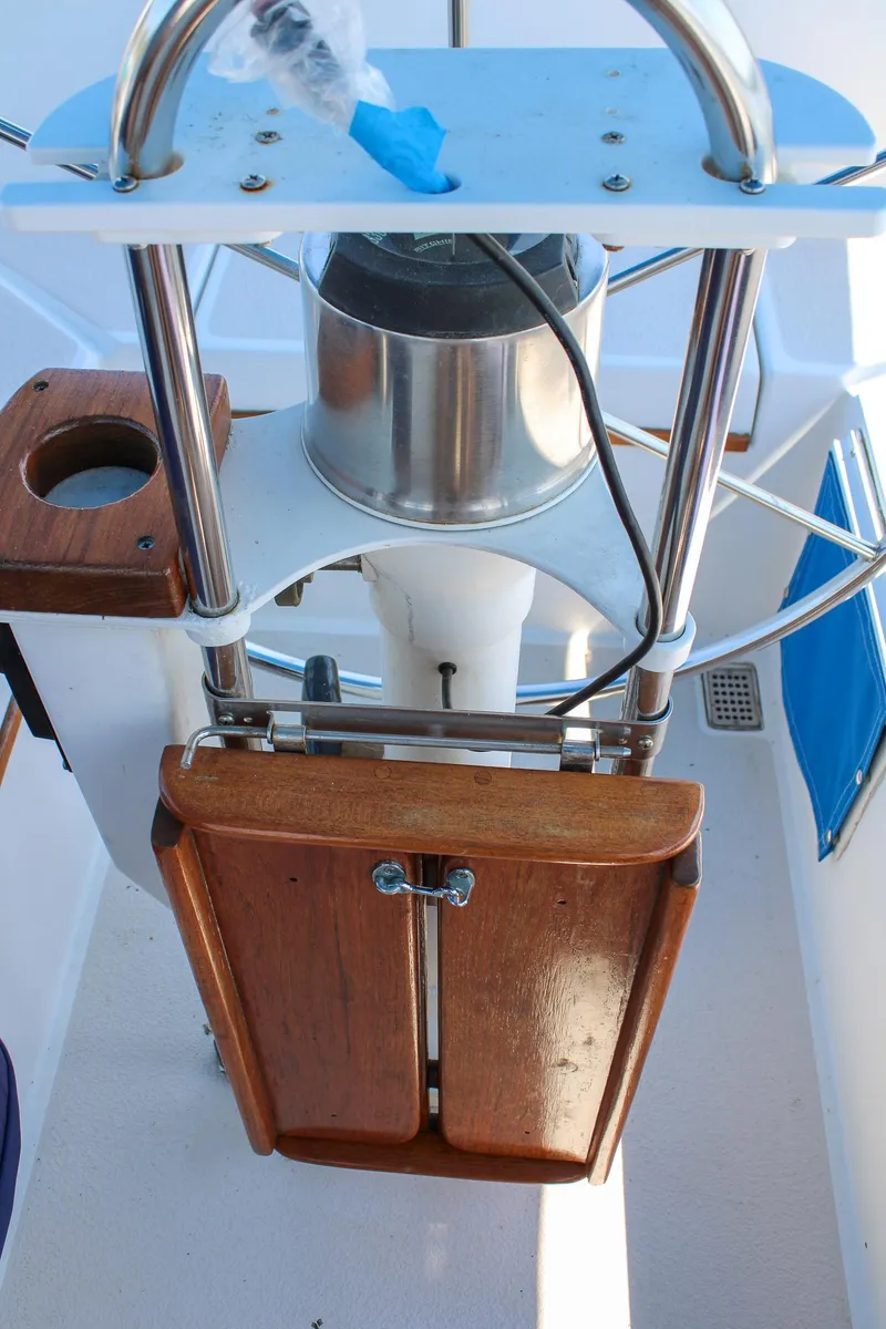 Slide: The Image of 1989 Morgan 44 Center Cockpit helm with wooden foldable table and stainless steel features. - 39