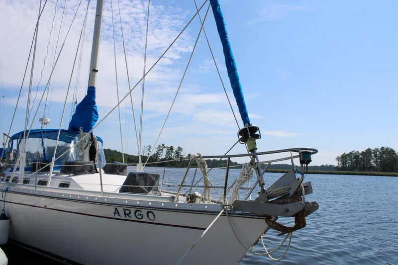 Slide: The Image of 1989 Morgan 44 Center Cockpit sailboat docked on a sunny day. - 4