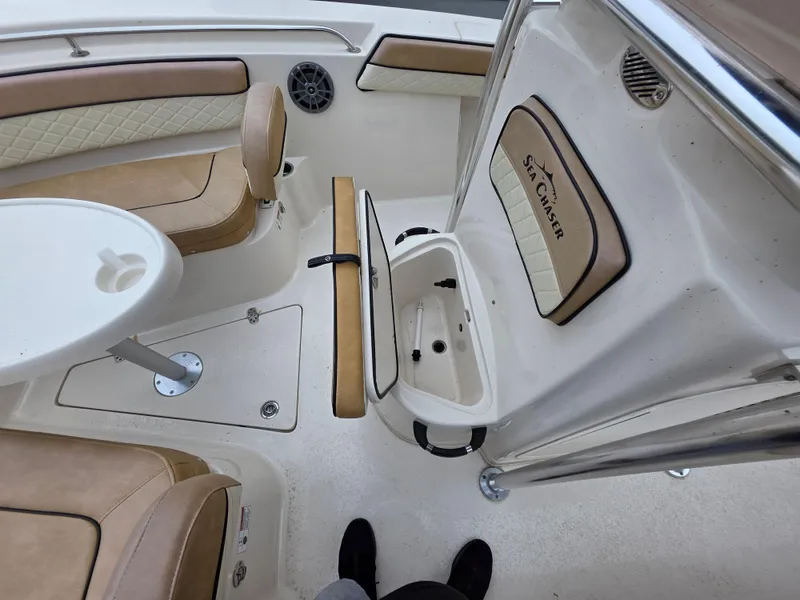 Slide: The Image of 2023 Sea Chaser 22 HFC boat interior with seating and storage compartments. - 18