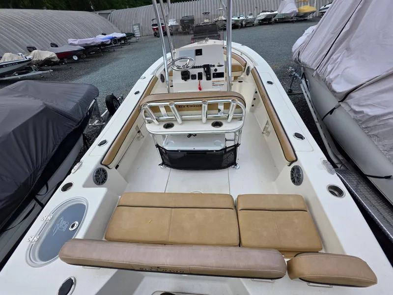 Slide: The Image of 2023 Sea Chaser 22 HFC boat interior with tan seating and control console. - 19