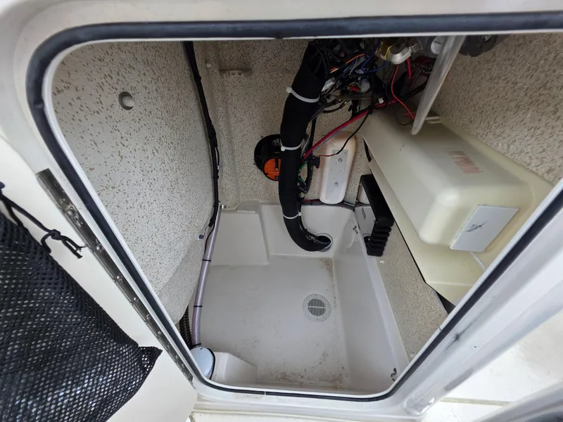 Slide: The Image of 2023 Sea Chaser 22 HFC boat storage compartment with wiring and drainage system. - 20