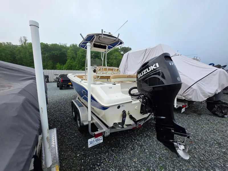 Slide: The Image of 2023 Sea Chaser 22 HFC boat with Suzuki outboard motor in storage yard. - 4