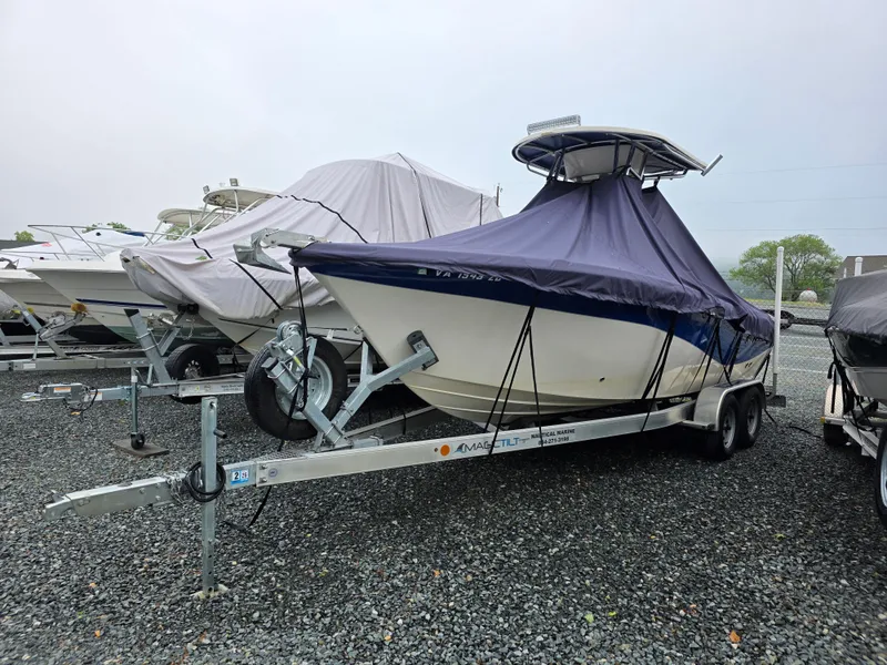 Slide: The Image of 2023 Sea Chaser 22 HFC boat covered on trailer in storage lot. - 5