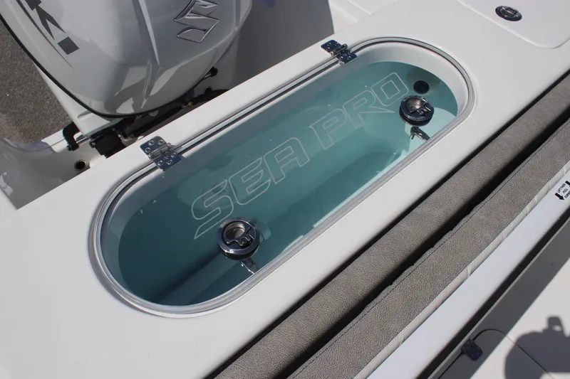 Slide: The Image of 2025 Sea Pro 222 boat livewell with clear lid and branding. - 12