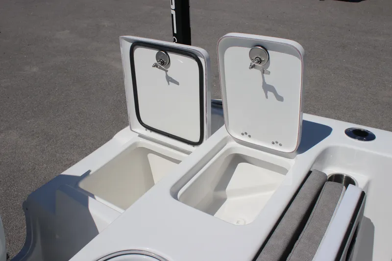 Slide: The Image of 2025 Sea Pro 222 boat storage compartments with open lids, showcasing interior space. - 16