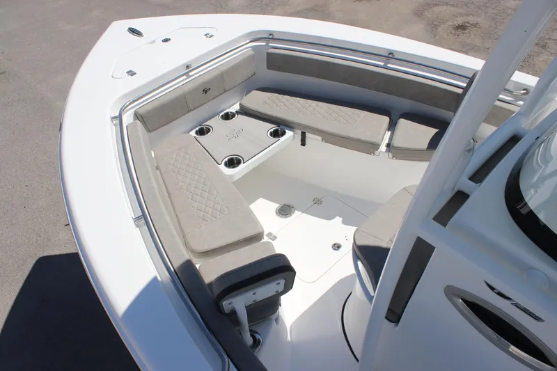 Slide: The Image of 2025 Sea Pro 222 boat interior with cushioned seating and cup holders. - 17