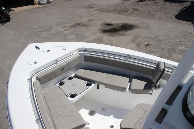 Slide: The Image of 2025 Sea Pro 222 boat interior with cushioned seating and cup holders. - 19